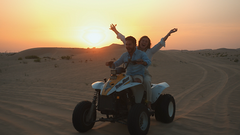 Ellie Green @thegingerwonderlust quad biking in the Liwa Desert Abu Dhabi