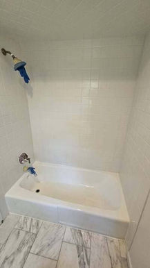 New white bathtub and shower