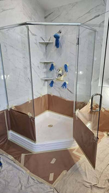 Corner glass shower with wooden base