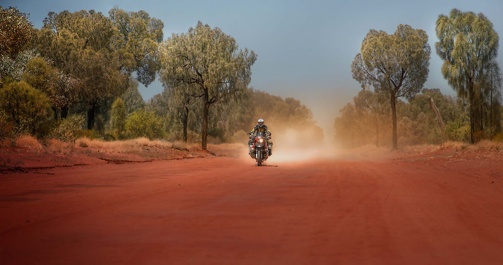 This is what Adventure Motorcycling is about, blasting down a desert track in Australia full throttle