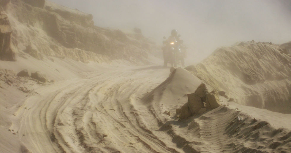 Adventure motorcycling extremes. Lisa stuck in a blasting sandstorm