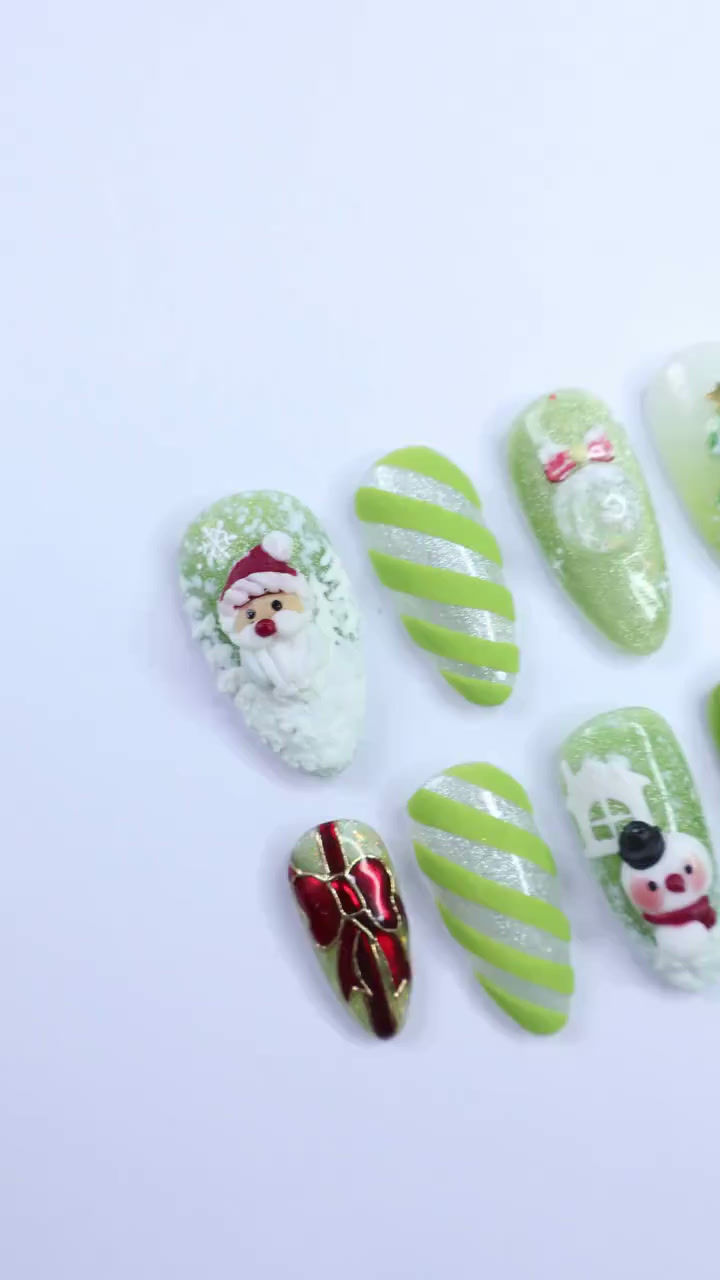Thumbnail: Festive Green Medium Almond Press-On Nails: Adorned with Santa Claus