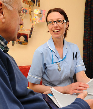 District nurse with male patient.JPG