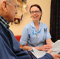 District nurse with male patient.JPG