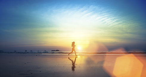 Woman Running on Beach.jpeg