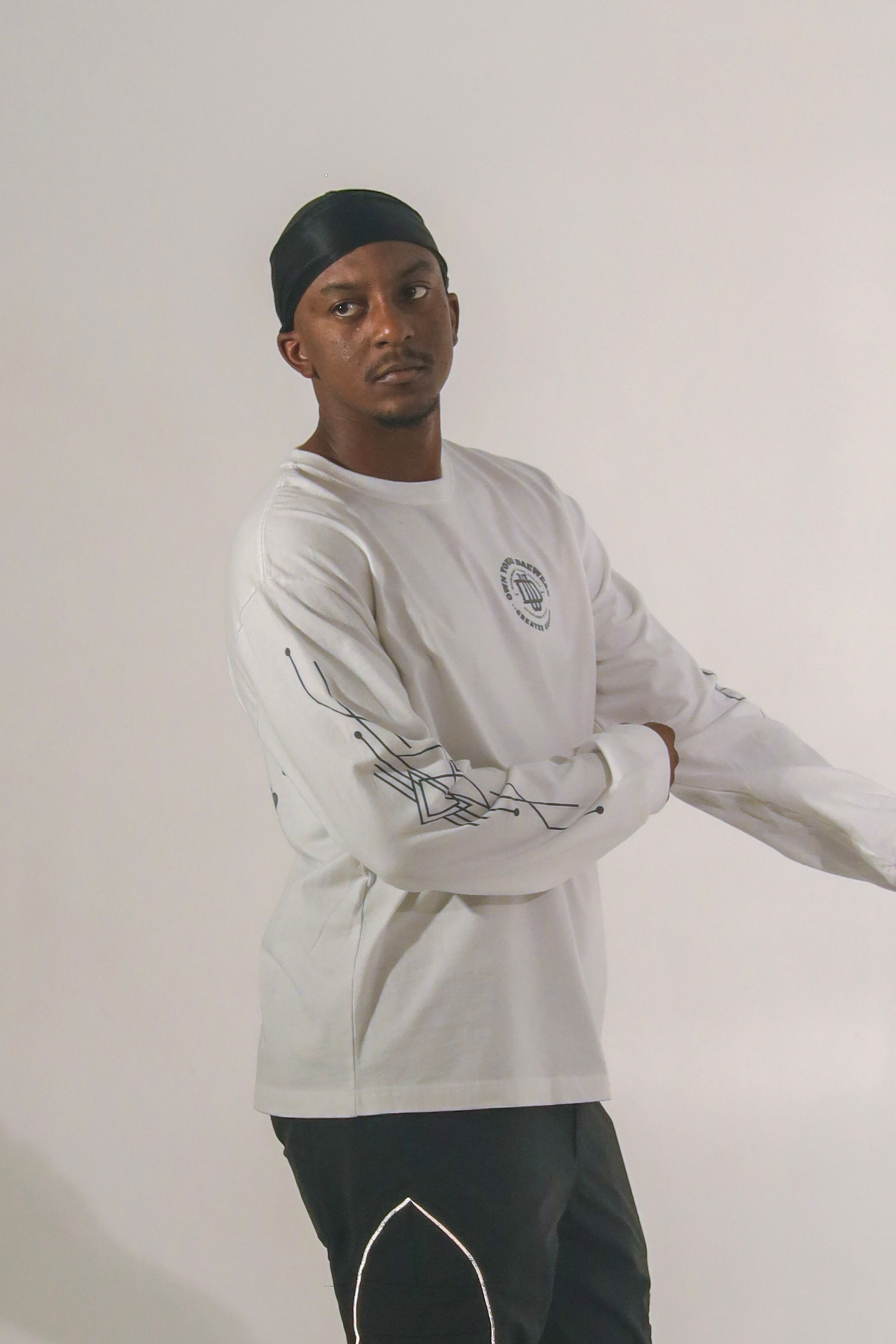 Side View Of Dae'Wear White Varsity Tee 