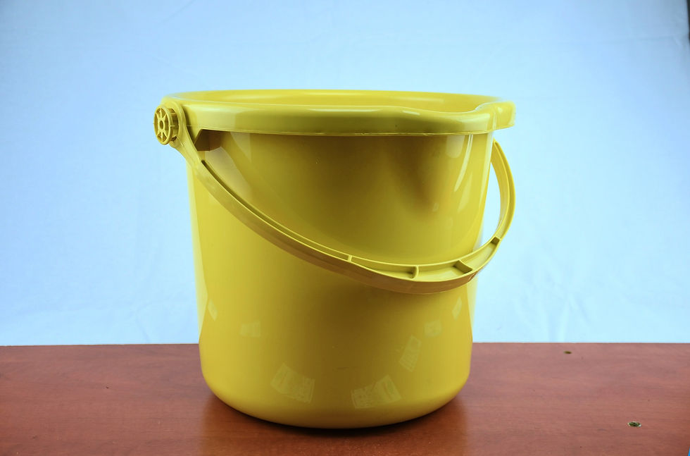 A bucket used for bowling ball cleaning at home