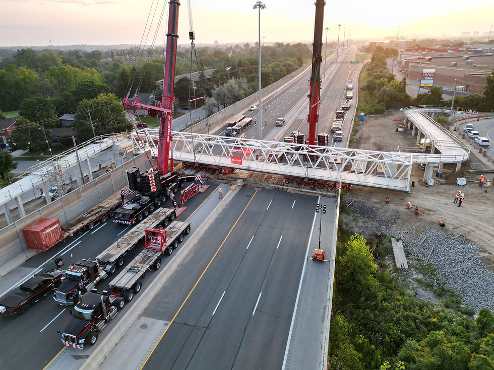 The truss span traversing Highway 7/8 on SPMTs.