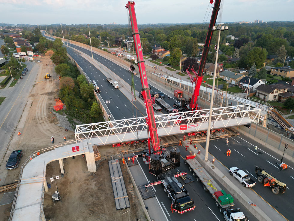 Two 500-tonne mobile cranes preparing for the final lift of the truss span.
