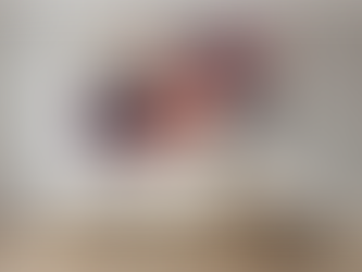 A person connecting with an original abstract painting by MMHC in a home, illustrating how to choose wall art.