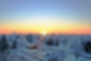 sun rises on a rural community covered with snow