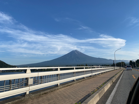 Crossing a bridge with Mt Fuji in the background on a clear day.
