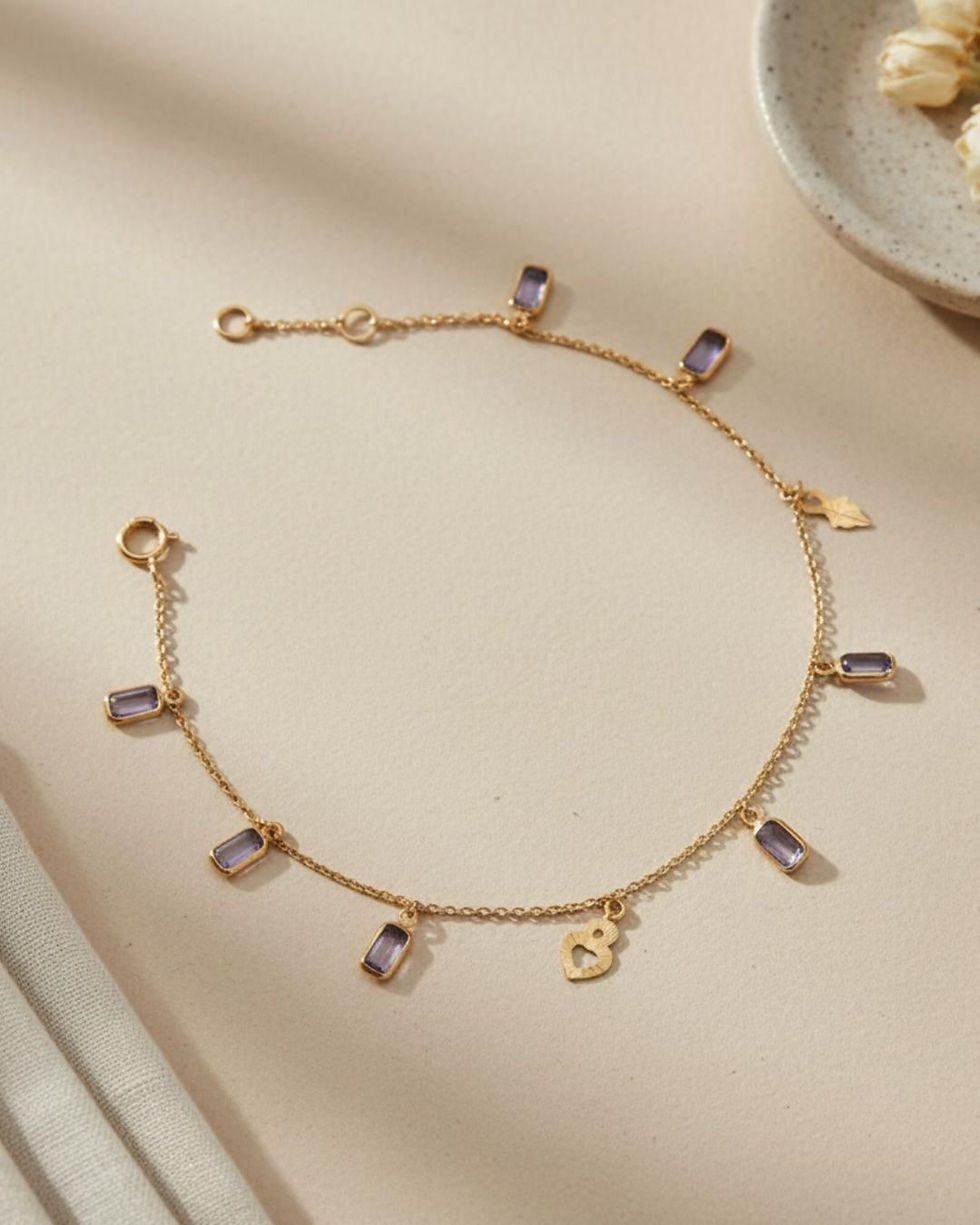 tanzanite charms bracelet in gold
