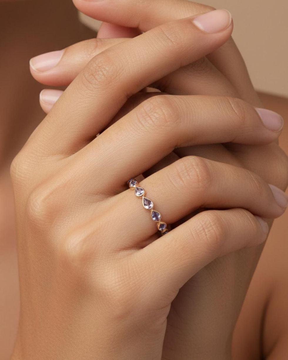 Thumbnail: pear cut tanzanite gold band ring