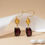 Thumbnail: 14k gold gemstone dangle earrings for gifting
