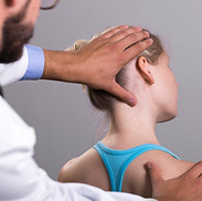 Chiropractor examining patient
