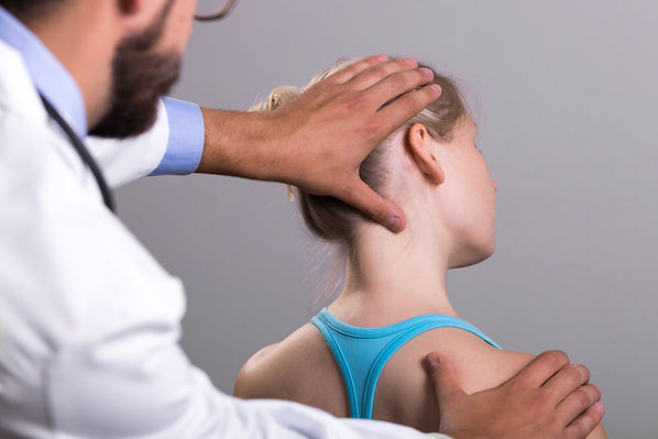 Chiropractor examining patient