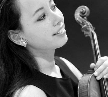 Julia Meynert, born in Bochum, Germany into a German-Japanese family on June 16th, 1986, got her first violin lessons at the age of 5 with Sigurd Josbaecher. Later she took lessons with Siegfried Rivinius, the first concert master of the ‘Deutsche Oper am Rhein’ in Duisburg. When Julia was 14 her whole family moved to Mannheim so Julia could continue her musical education. She then joined the class of Prof. Roman Nodel at Mannheim University of Music and Performing Arts in Germany. At the age of 16 she started her “Diplom Künstlerische Ausbildung” in the class of Prof.Nodel. In 2006 she moved to Vienna, Austria, to continue her studies with professor Pavel Vernikov at the Vienna Conservatory (Musik und Kunst Privatuniversität der Stadt Wien). From 2005 to 2008 Julia commuted between Germany/Austria and Italy for additional lessons at the Scuola di Musica di Fiesole and the Scuola di Musica di Mantova in Italy with professor Pavel Vernikov and Oleksandr Semchuk. In June 2010 Julia Meynert earned her Bachelor’s diploma at the Vienna Conservatory in the class of Prof. Zwiauer (First Concert Master, Wiener Symphoniker). In August 2010 she moved to New York City. In December 2011 she earned her Performer´s Certificate in the class of Prof. Yi-Wen Jiang (2nd violinist of the Shanghai Quartet). In 2013, Julia joined the class of Masao Kawasaki in New York.
Julia won 1st prize at the Landeswettbewerb Jugend Musiziert in 1998 and 2001 and 3rd prize at the Luigi Nono Competition in 2008.
In 2010 Julia Meynert performed as a substitute (1st violin) of the Vienna Philharmonic Orchestra.
As a soloist Julia performed with the orchestras Philharmonic Orchestra of Baden-Baden (Germany), KKO chamber orchestra (Kurpfaelzisches Kammerorchester, Germany), the Academic Symphony Orchestra of Kiev (Ukraine), Jackson Heights Orchestra (New York), and the Town and Country Symphony Orchestra of St. Louis.
In February and April 2017 Julia performed live and gave a live interview on the radio station “Las Tres Jotas” in NY. In August 2018 Julia had an interview and airing of her recordings on the radio station RAF in St. Louis.
Julia regularly performs with the Music for Life International Philharmonic at Carnegie Hall.
In summer 2008 Julia was invited to perform as the principal second violinist in a chamber orchestra at the Oleg Kagan Festival in Germany which was run by cellist Natalia Gutman where Ms.Gutman joined the stage. In July 2013 Julia was invited to perform at the renowned “Lockenhaus Festival” in Austria.
Julia was a violin faculty at The Palisades School of Music in New Jersey from 2012-2017 and at the Performing Arts Conservatory of New York from 2014-2017. Julia joined the faculty at the Dana Hall School of Music this year in Wellesley, Massachusetts and also at Dexter Southfield School in Brookline, Massachusetts.
Julia performs with pianist Riko Higuma in a Carnegie Hall concert scene in the movie “Love is Strange” by renowned film director Ira Sachs, together with Hollywood actors Marisa Thomei, John Lithgow, and Alfred Molina.
In summer 2017 Julia and pianist Gerald Robbins were filmed for the documentary TIME by film producer Vienzenz where they perform many works by Viennese composers. The movie was premiered in October 2018 at the “Topkino” in Vienna, Austria.