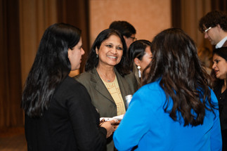 Women talking at corporate event