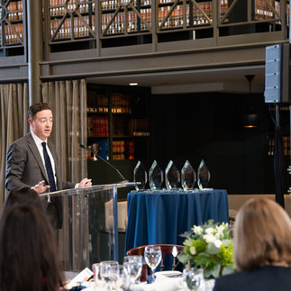 Male speaker at corporate award ceremony