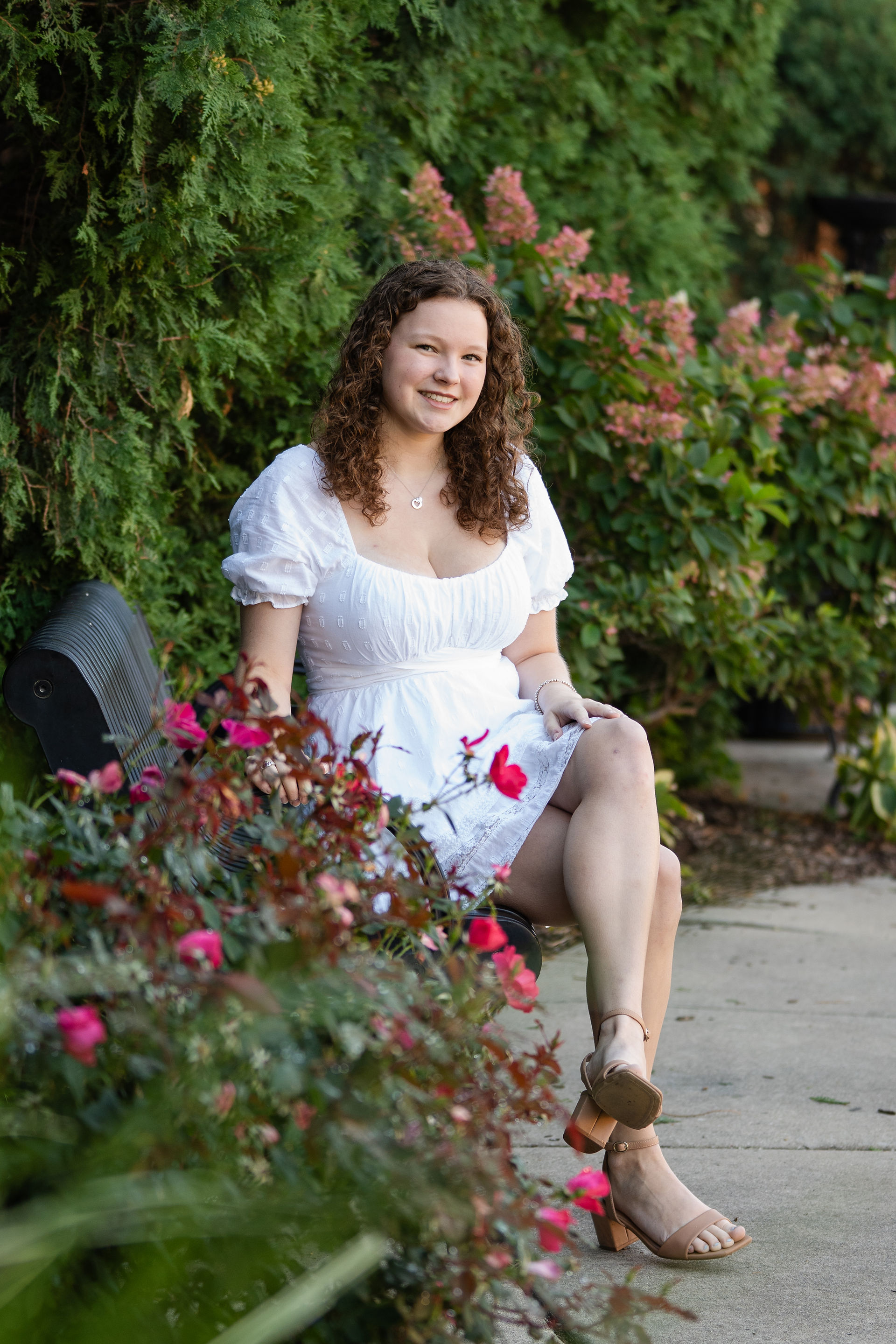 Girl sitting on bench in downtown Arlington Heights