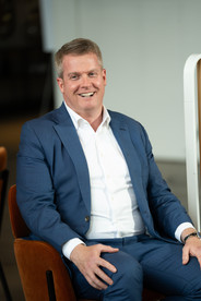 man smiling at corporate event