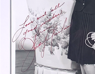 A personally signed message 'Love and all good wishes from Judy Garland'