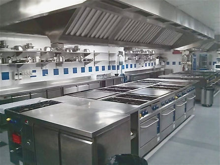 Custom-designed stainless steel commercial kitchen optimized for space and workflow efficiency.