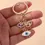Thumbnail: Hamsa Hand & Evil Eye Keychain
