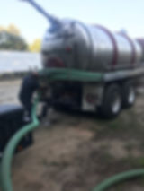 Worker pumpin a septic tank in Winder, Georgia