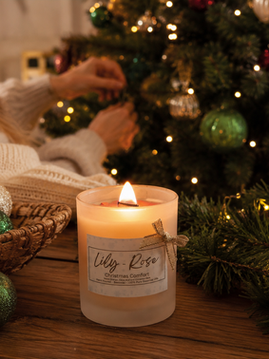 Christmas candle made with beeswax and essential oils creating a warm festive atmosphere at home.
