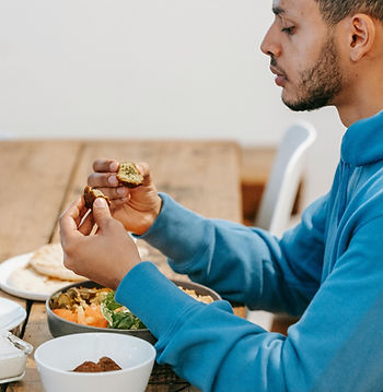 man sitting and eating a meal mindfully