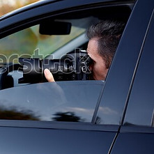 young-man-dslr-camera-car-600w-153160060