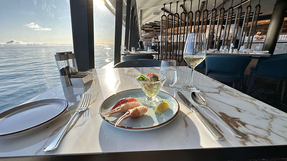Seafood lunch aboard the luxury cruise ship Explora I by Explora Journeys, with panoramic ocean views.