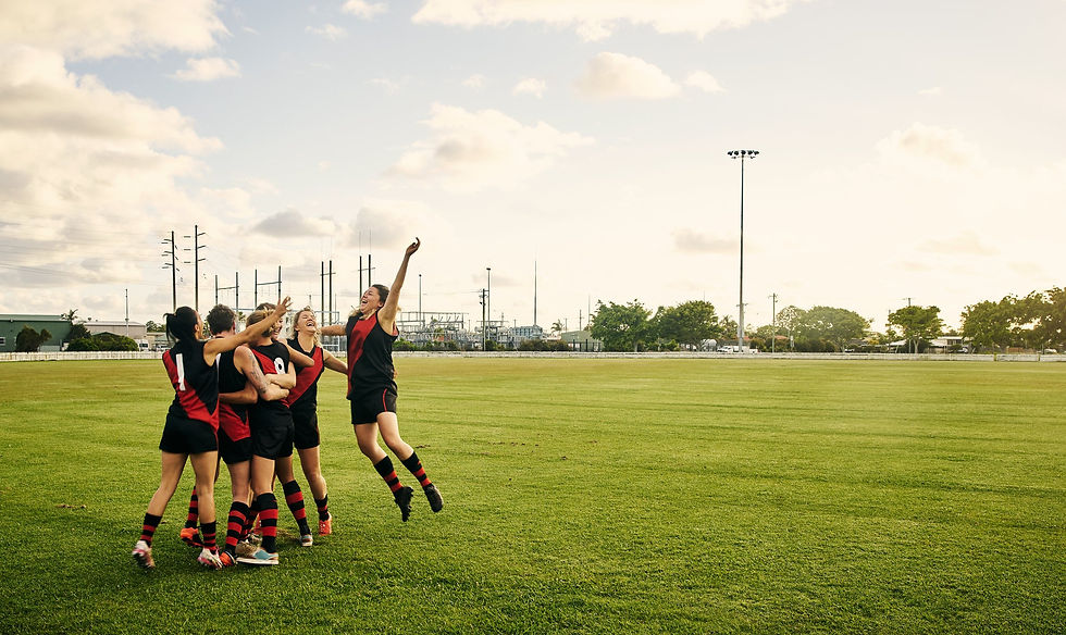 A soccer team celebrating on the field.
