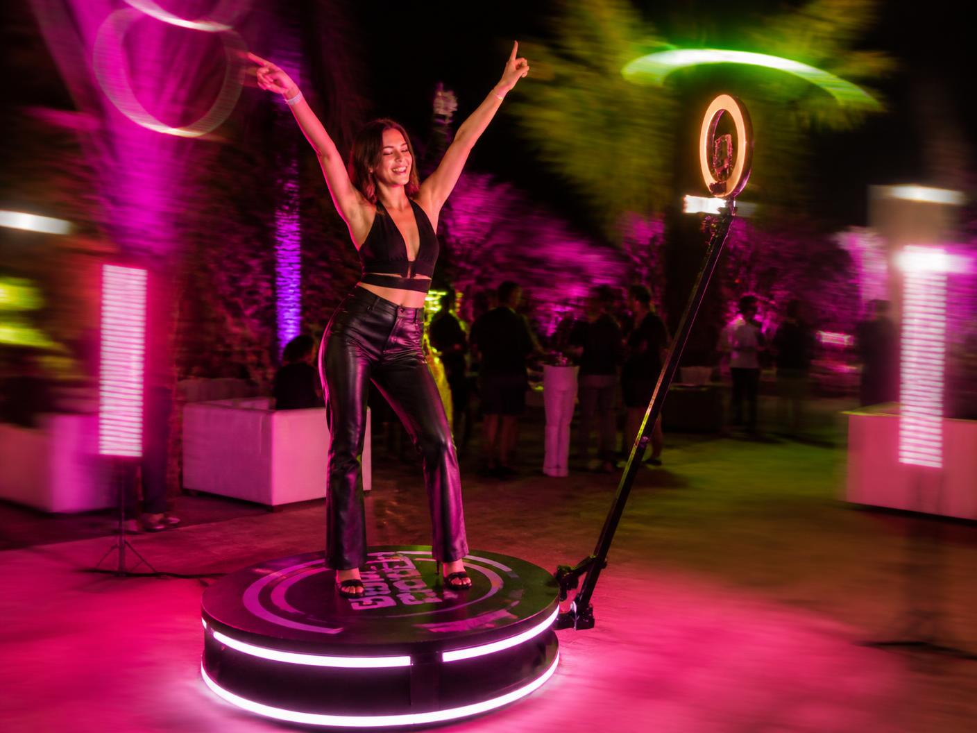 360 spinning booth with colorful party lighting