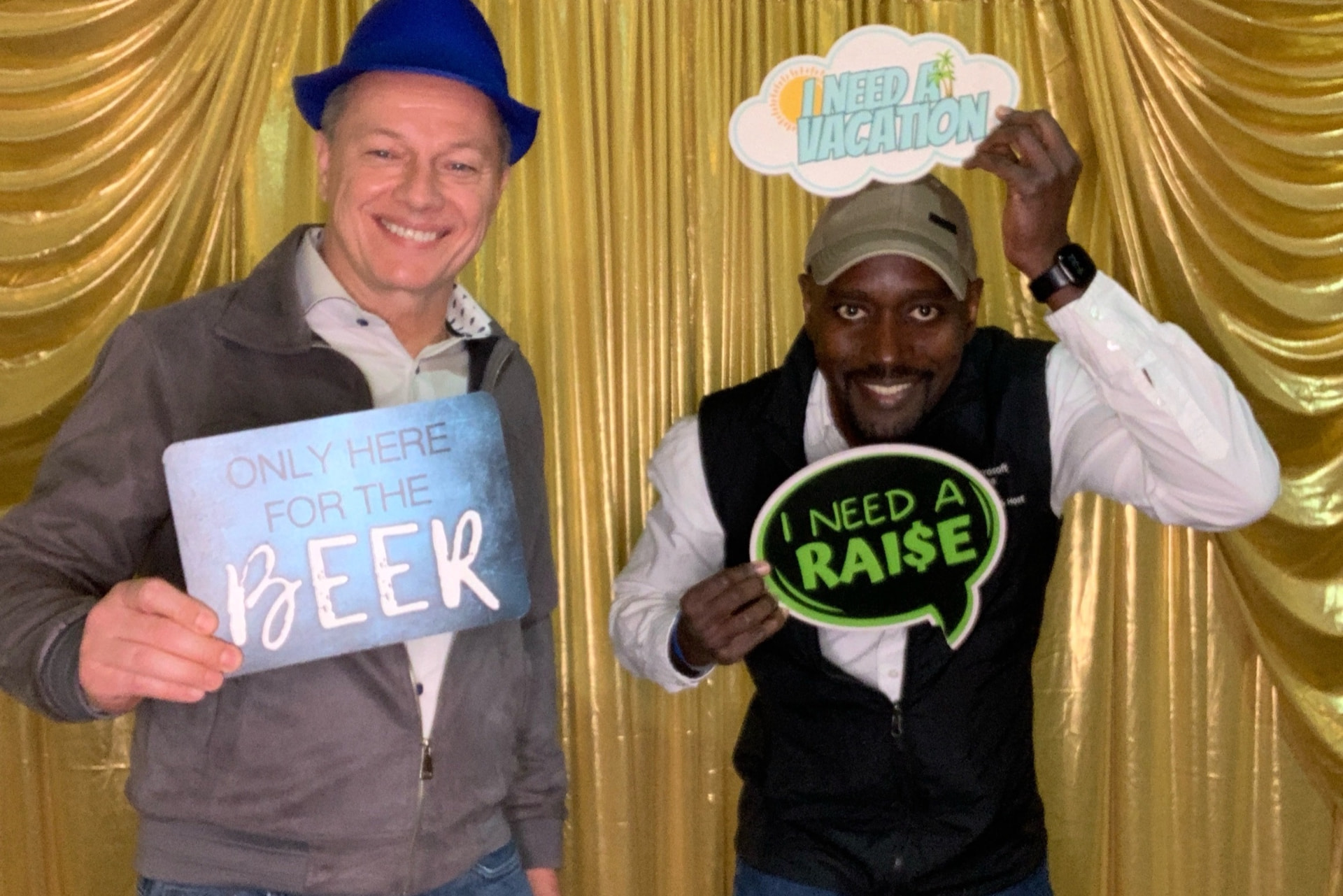 Friends toasting at the photo booth during a brewfest event