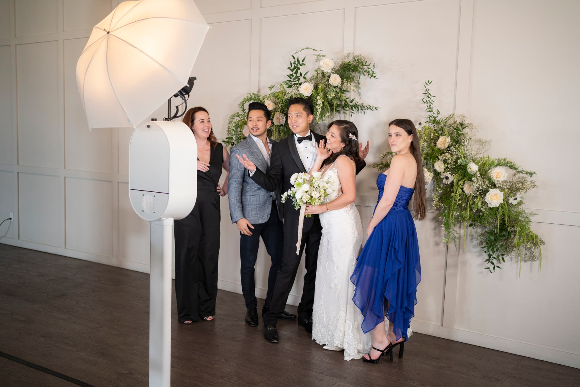 Guests with props at a branded corporate photo booth