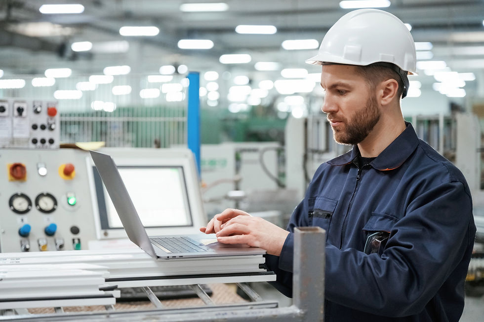 using-laptop-factory-worker-is-indoors-with-hard-hat_edited.jpg