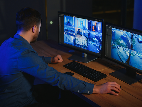 security-operator-controls-cctv-cameras-in-office-2024-04-16-01-26-26-utc 1.png