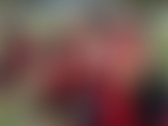 London Broncos Women prepare for a game by hitting tackle bags in their warm up