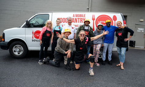 The Let's Eat Crew in front of the Mobile Food Pantry