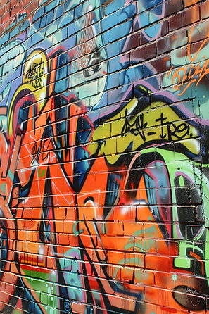vibrant-graffiti-mural-brick-wall-urban-alleyway-daylight.jpg