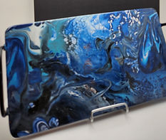 Bold blue acrylic pour art on home goods — unique art gifts for home décor lovers.