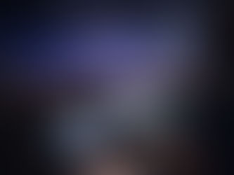 Live event AV technician monitoring video, audio, and show cues from the control position during a corporate conference