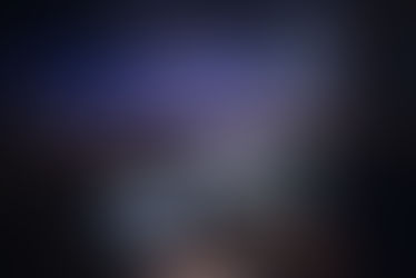 Live event AV technician monitoring video, audio, and show cues from the control position during a corporate conference