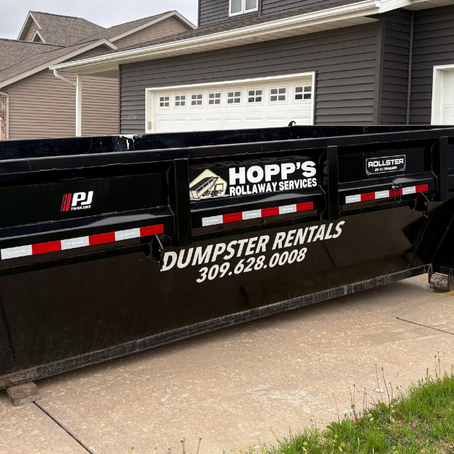 Hopp's Dumpster in a driveway