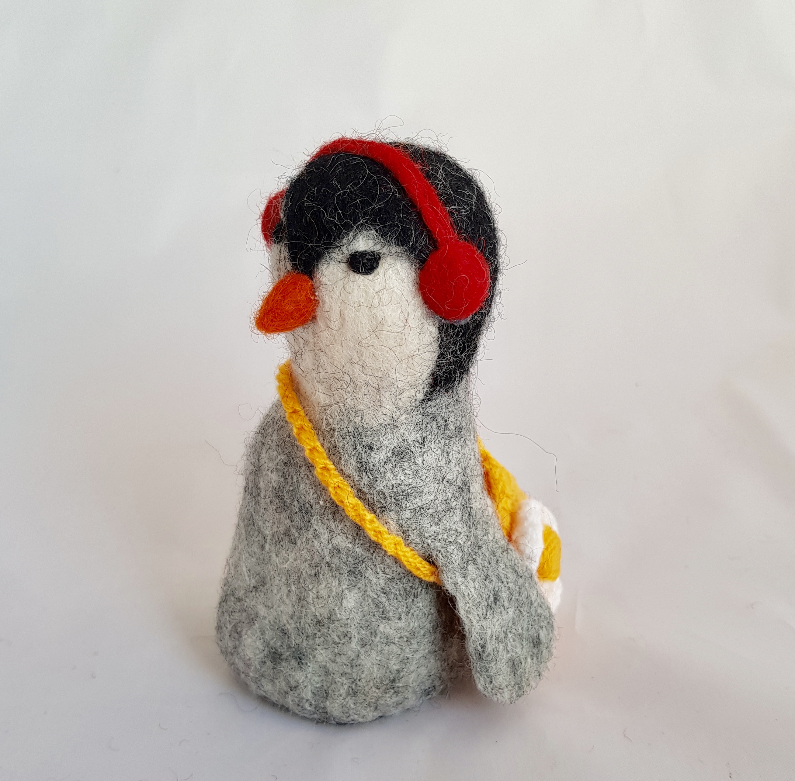 Penguin with headphones tree topper.