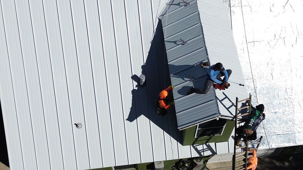 Eye-level view of a modern metal roof on a suburban home