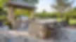 a-photo-of-an-outdoor-bar-with-a-built-in-grill-and-outdoor-kitchen-area-1.jpg.webp